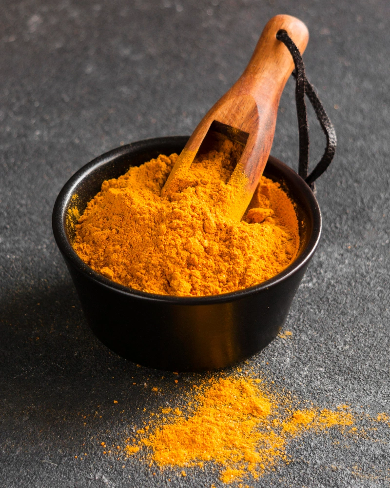 Turmeric powder and roots golden colour