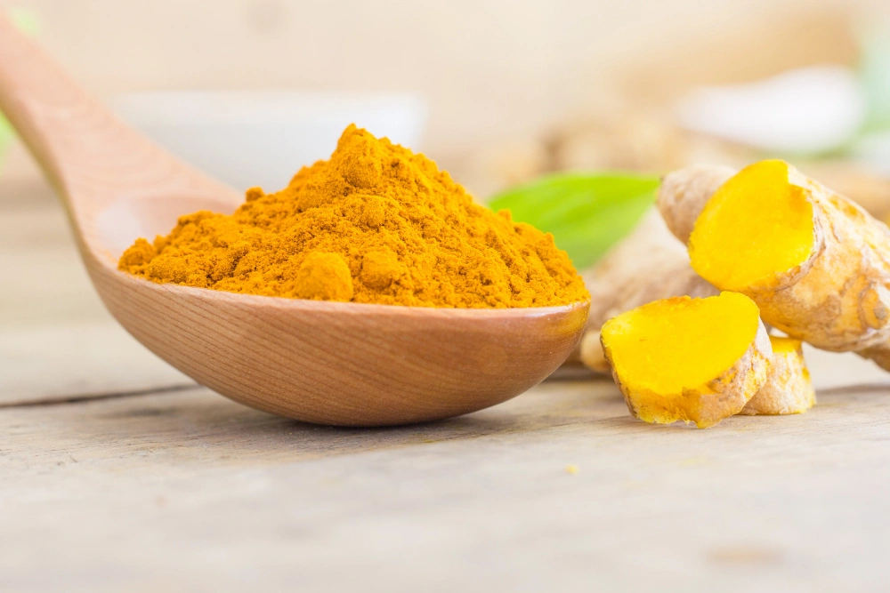 Turmeric root fingers India golden
